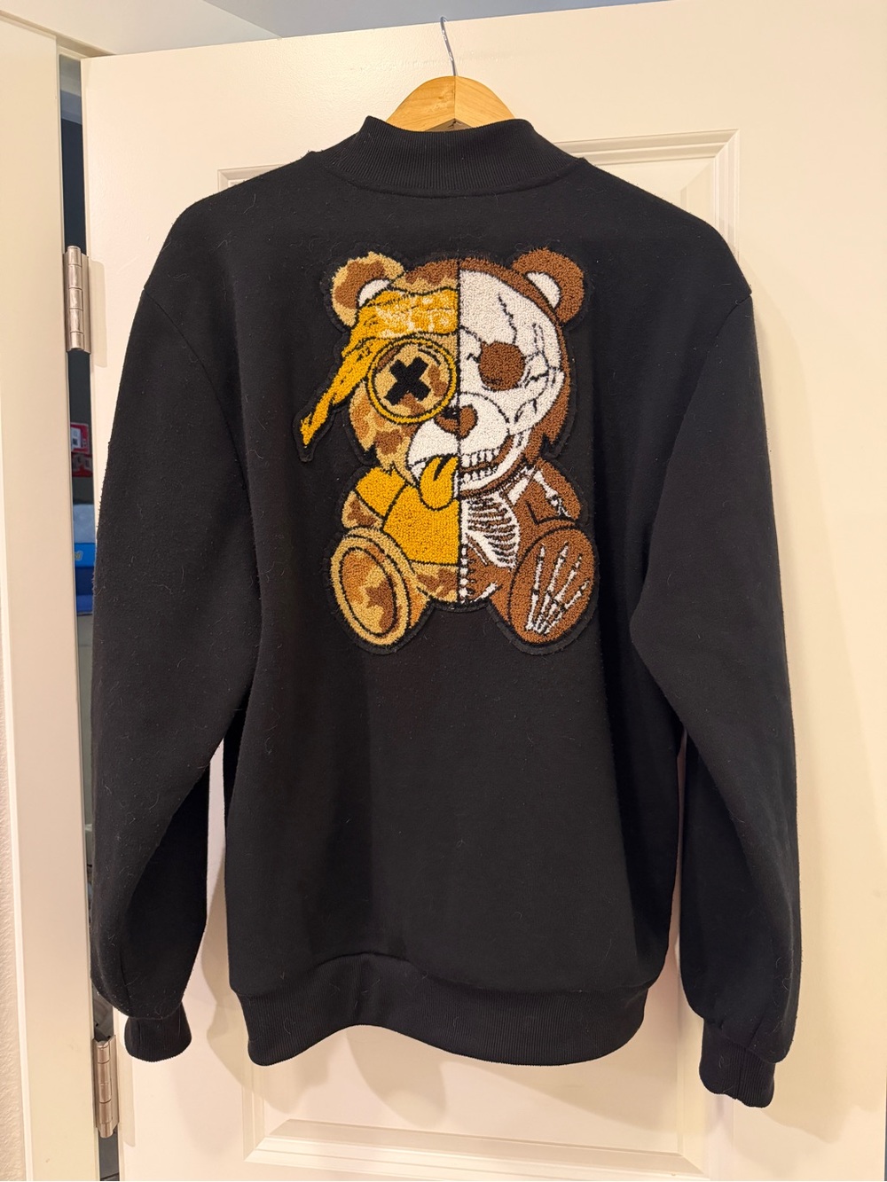 Black Crewneck Sweater with Split Teddy Graphic
